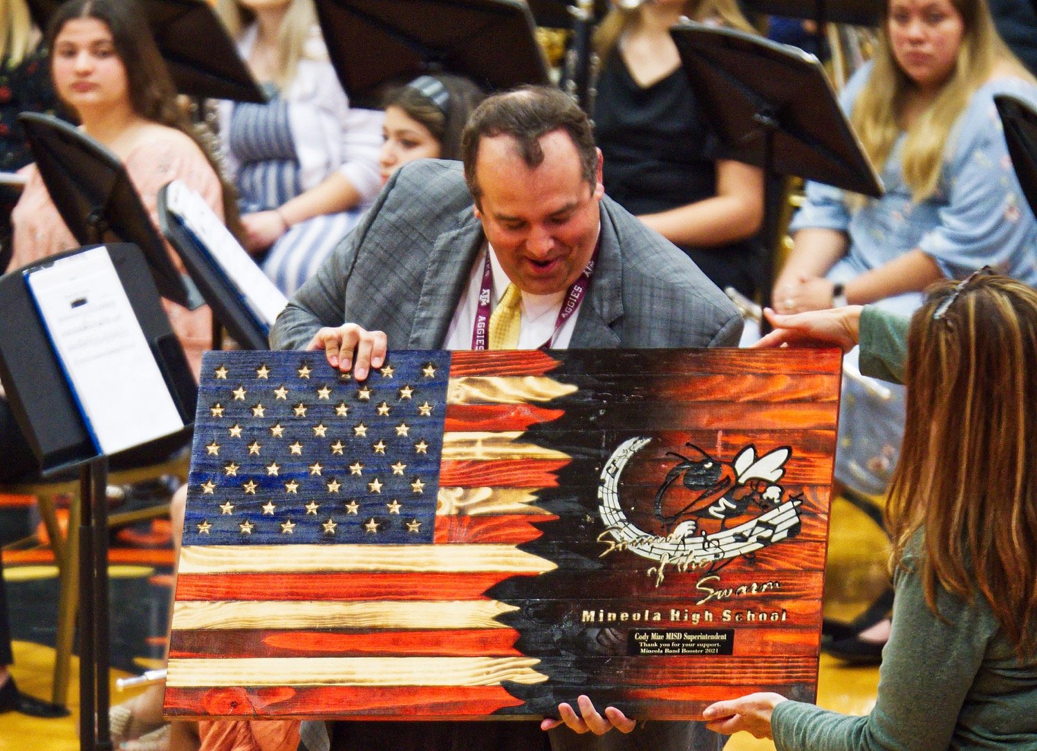 The band boosters present Supt. Cody Mize with a token of their appreciation for his support of the fine arts program.